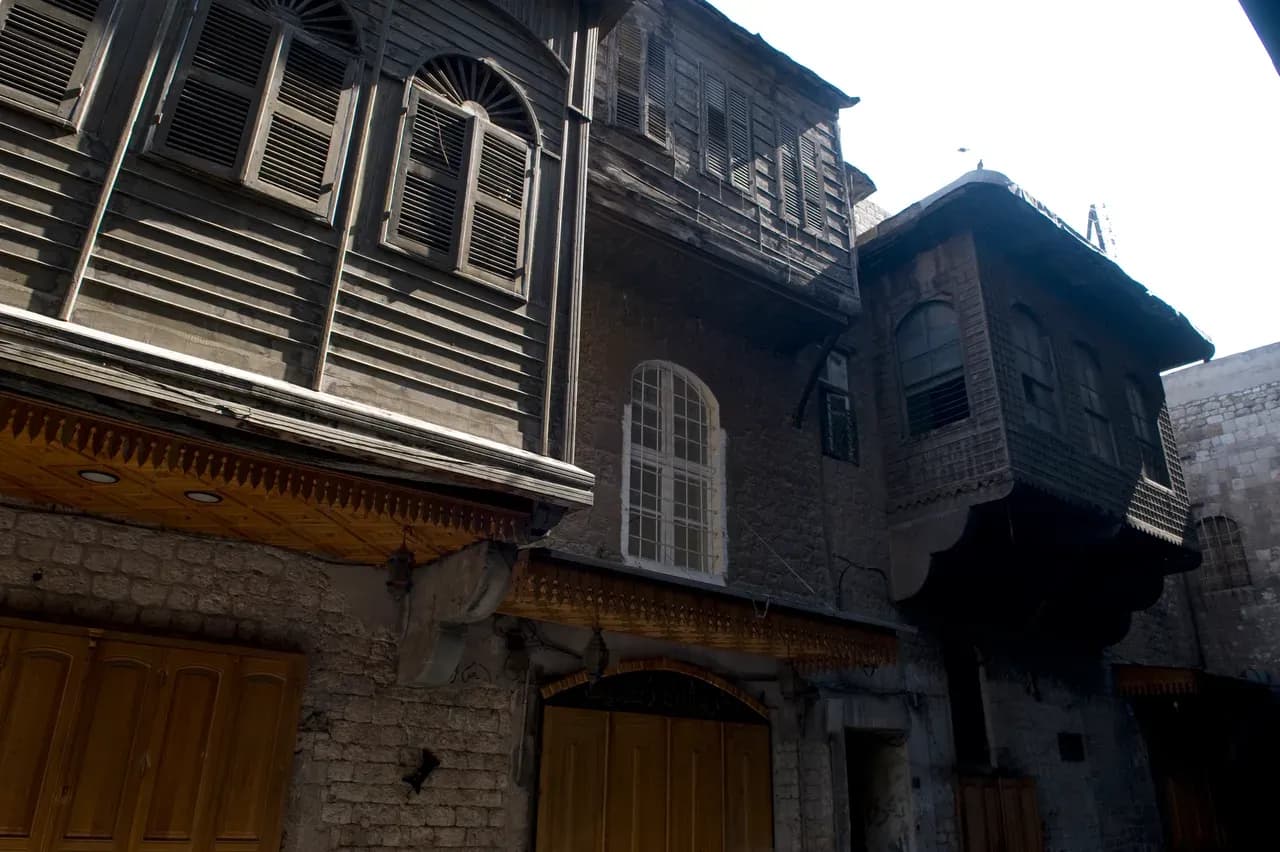 Stone buildings and a narrow street in Aleppo’s Jdeideh quarter, photographed in 2009.