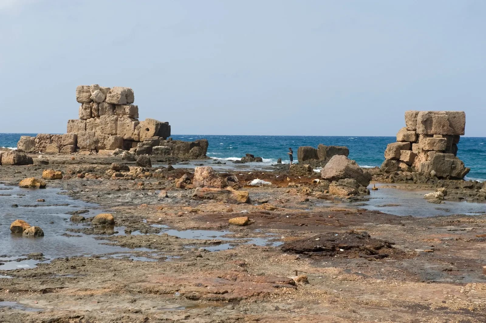 Large stone remains along Arwad island shore with the Mediterranean behind, September 2008