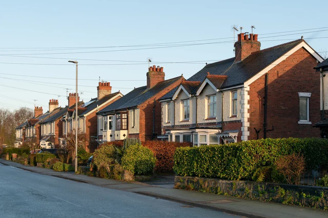Houses with front hedges along Sandbach Road North in Alsager, Cheshire, England