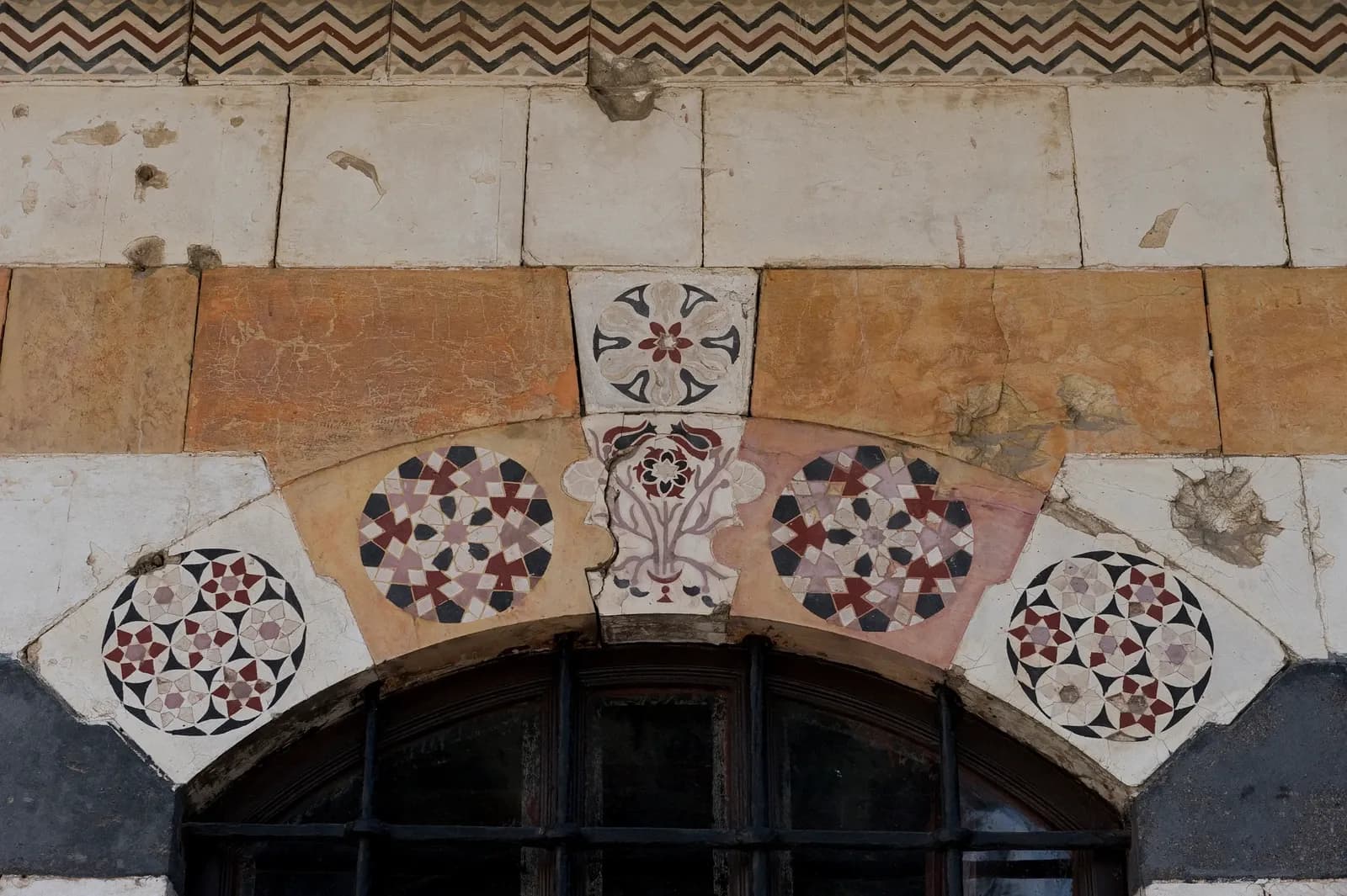 Geometric and floral patterned ornament above an opening at Azem Palace in Damascus, in an archive photograph