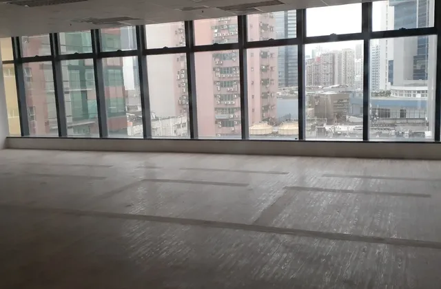 Unfurnished office with broad windows and a view of nearby buildings in Kwun Tong, Hong Kong