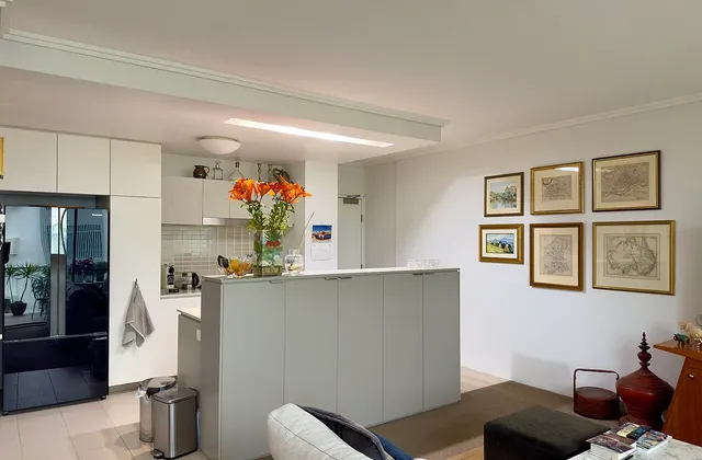 Kitchen cabinets and room connections in a Brisbane apartment, June 2025