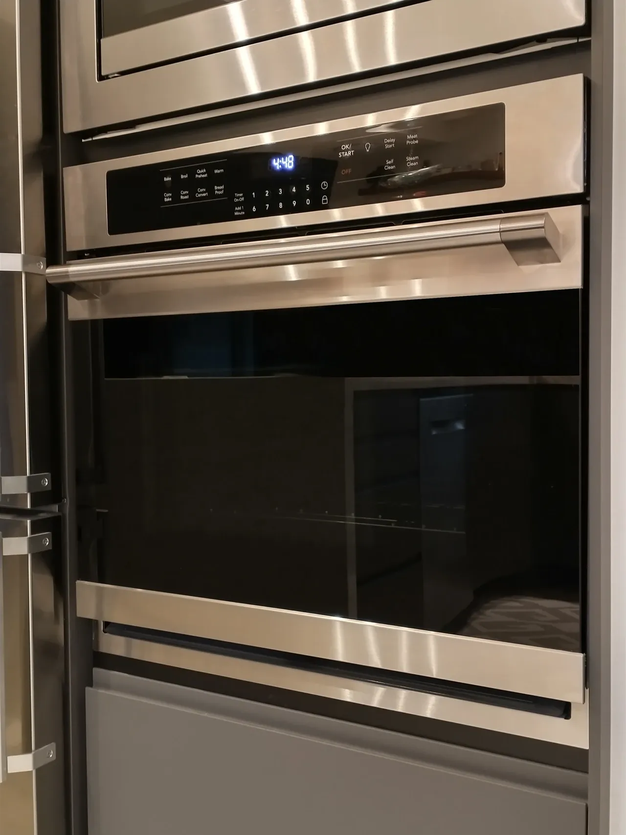 Built-in oven with glazed door and control panel in a California kitchen, photographed in December 2023