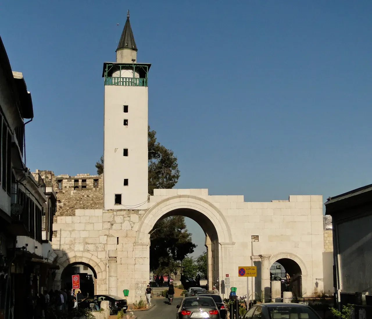 Bab Sharqi gateway in Damascus with its stone arch and minaret, photographed in 2010.