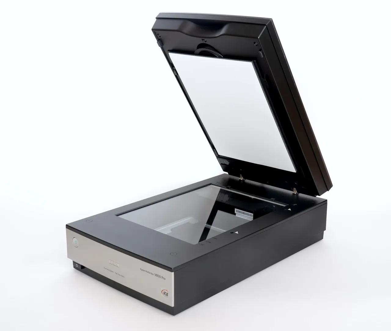 Open flatbed scanner with its lid raised and glass bed visible, photographed in September 2023