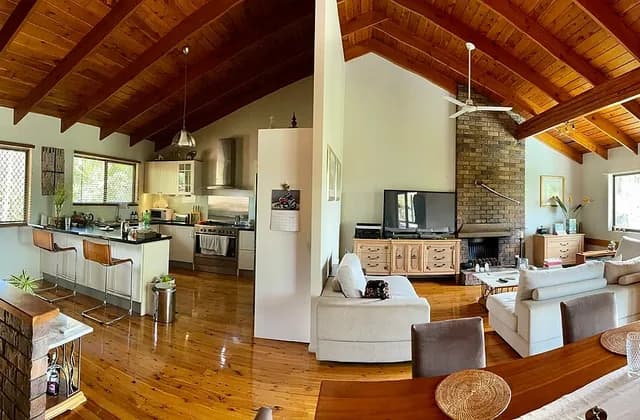 Open-plan kitchen, seating and dining space in a home in Corinda, Queensland, Australia