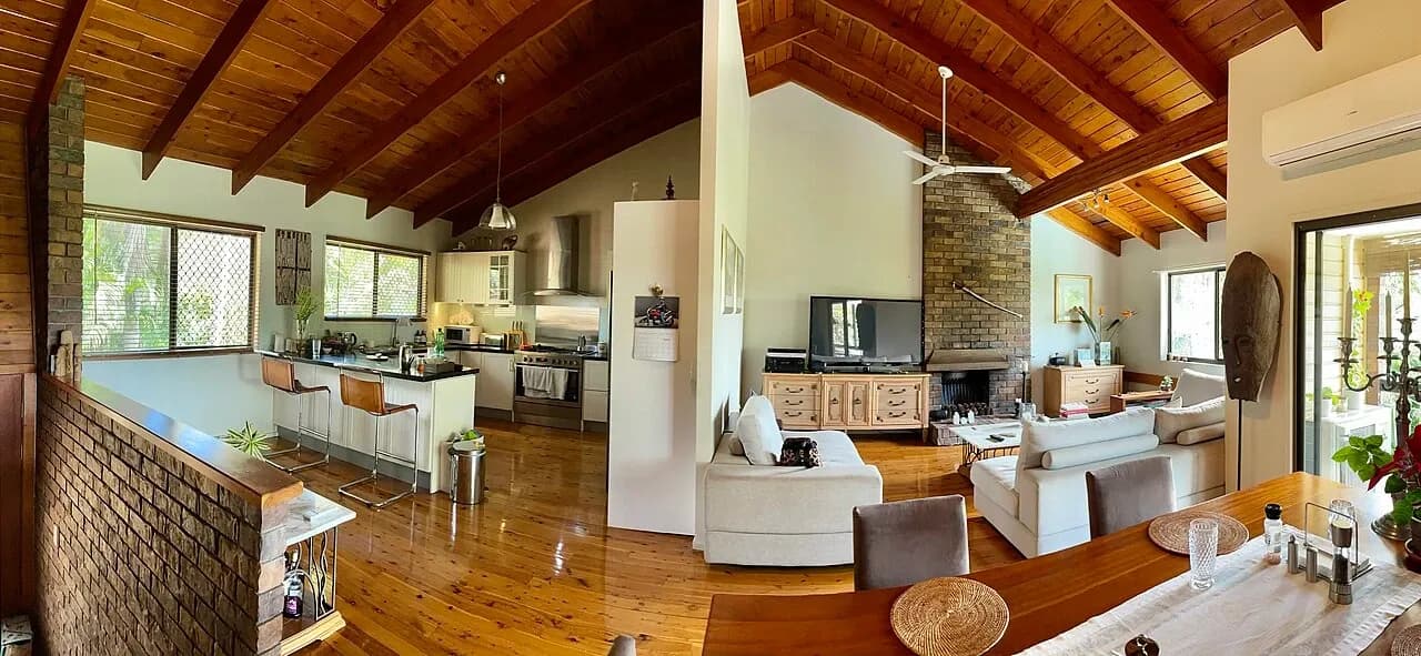 Open-plan kitchen, seating and dining space in a home in Corinda, Queensland, Australia