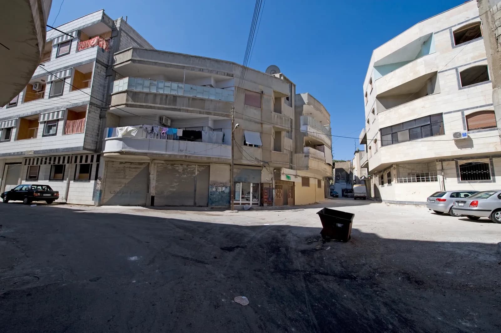 Multi-storey homes and a street corner in Homs, September 2008