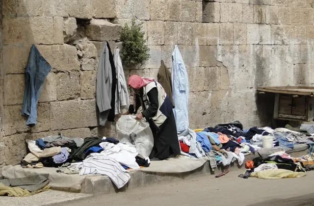 Archive view of a clothing stall in a Ma'arrat al-Numan market, Idlib Governorate, photographed by Bernard Gagnon on 3 April 2010.