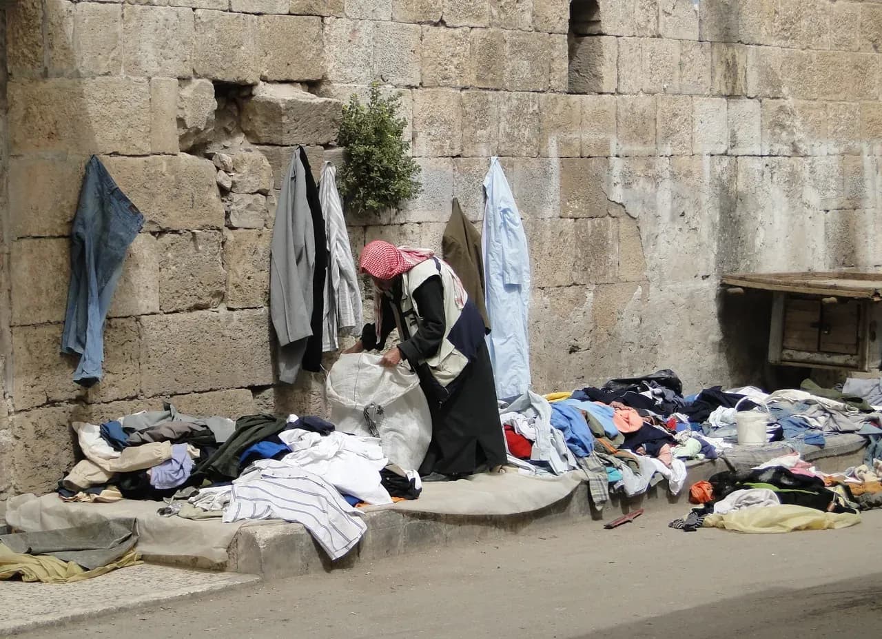 Archive view of a clothing stall in a Ma'arrat al-Numan market, Idlib Governorate, photographed by Bernard Gagnon on 3 April 2010.