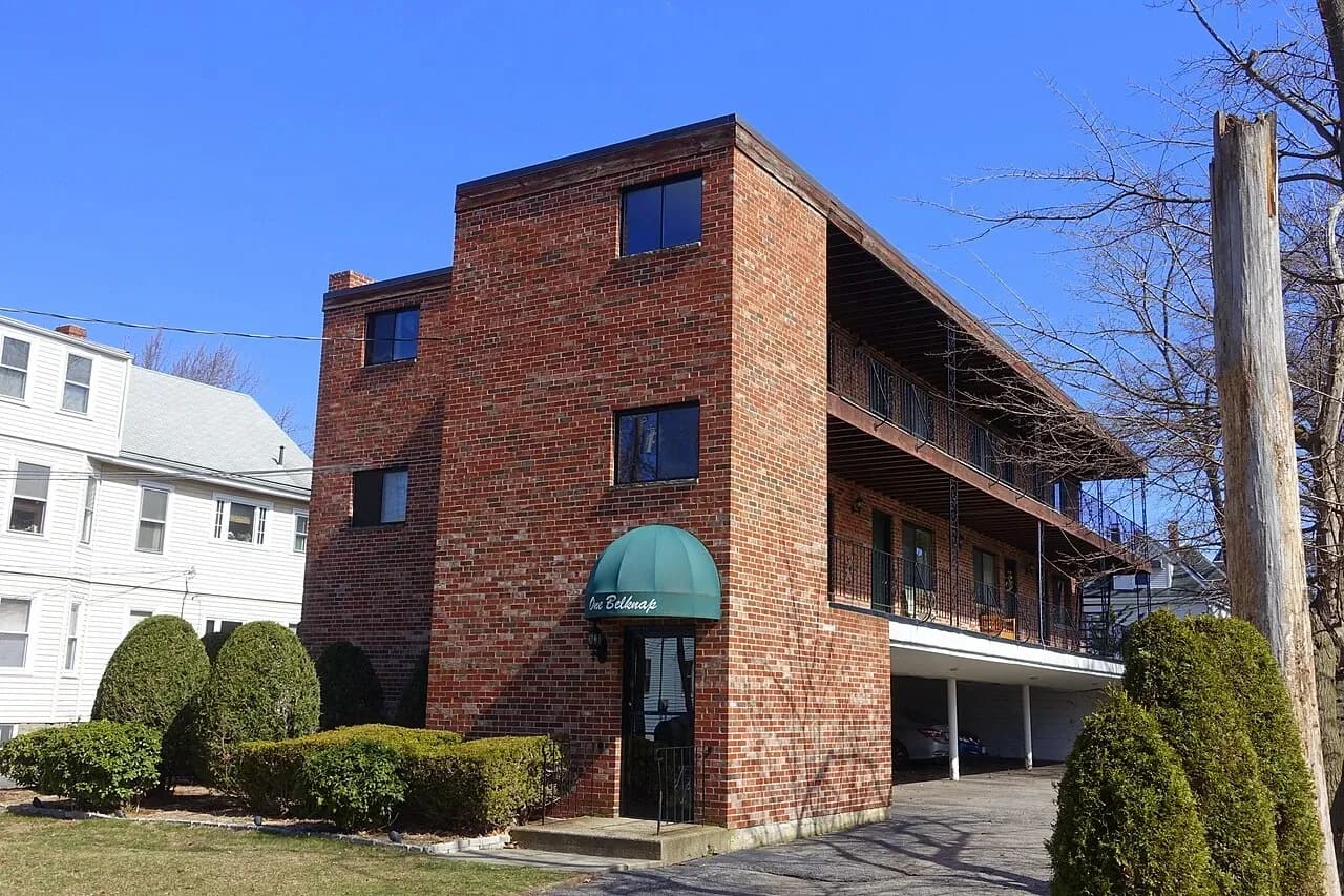 Brick apartment building with open balcony corridors in Arlington, Massachusetts