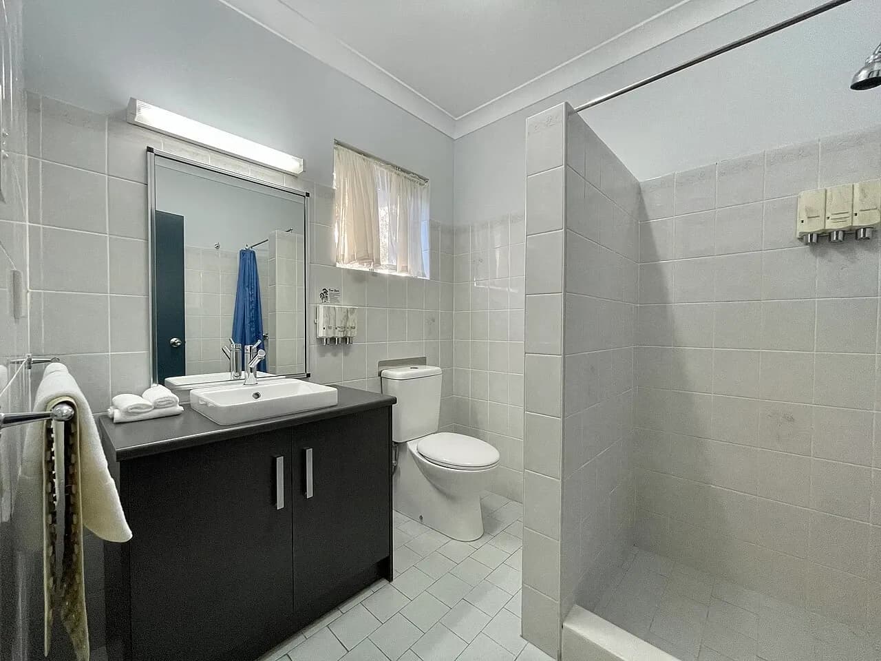 Bathroom with a shower enclosure and vanity at accommodation in Grafton, Australia