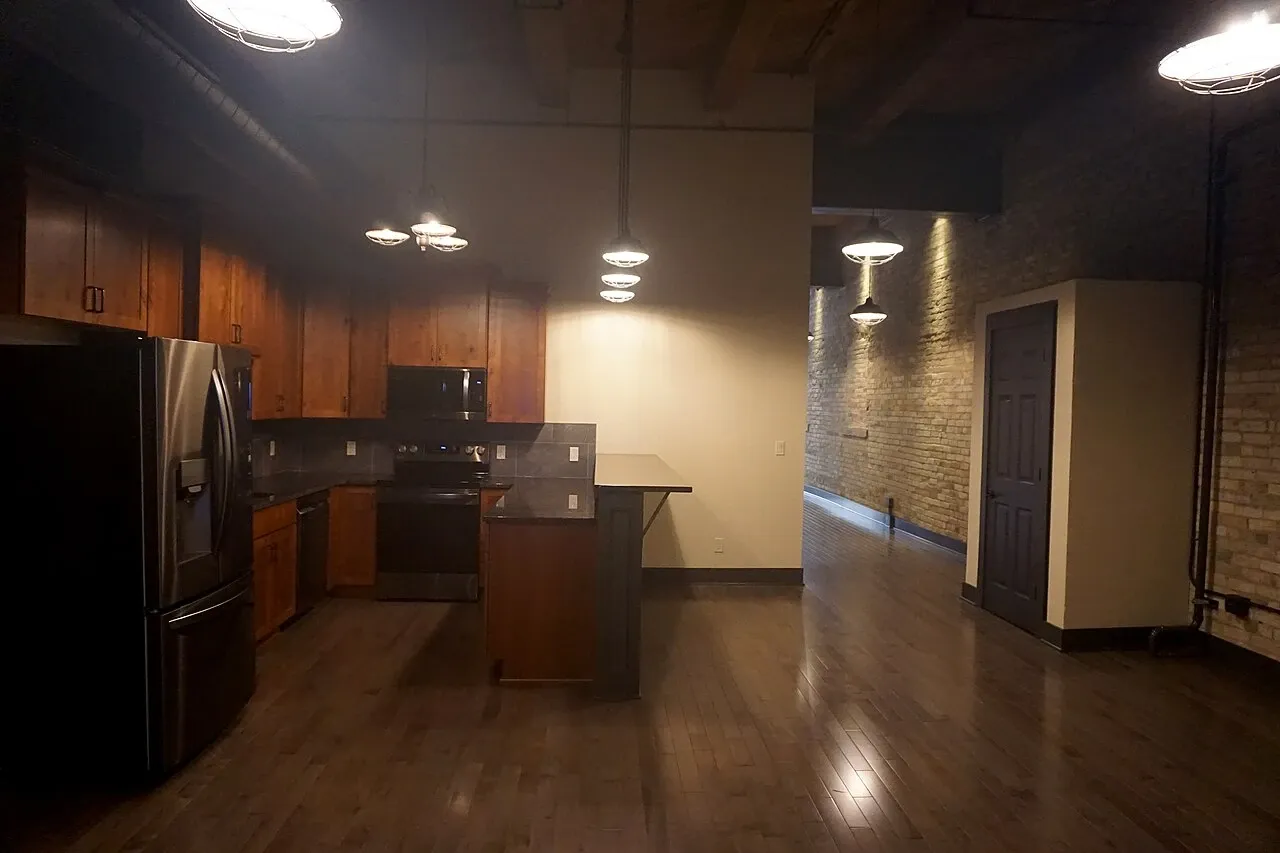 Kitchen and exposed-brick living space viewed during Doors Open Milwaukee