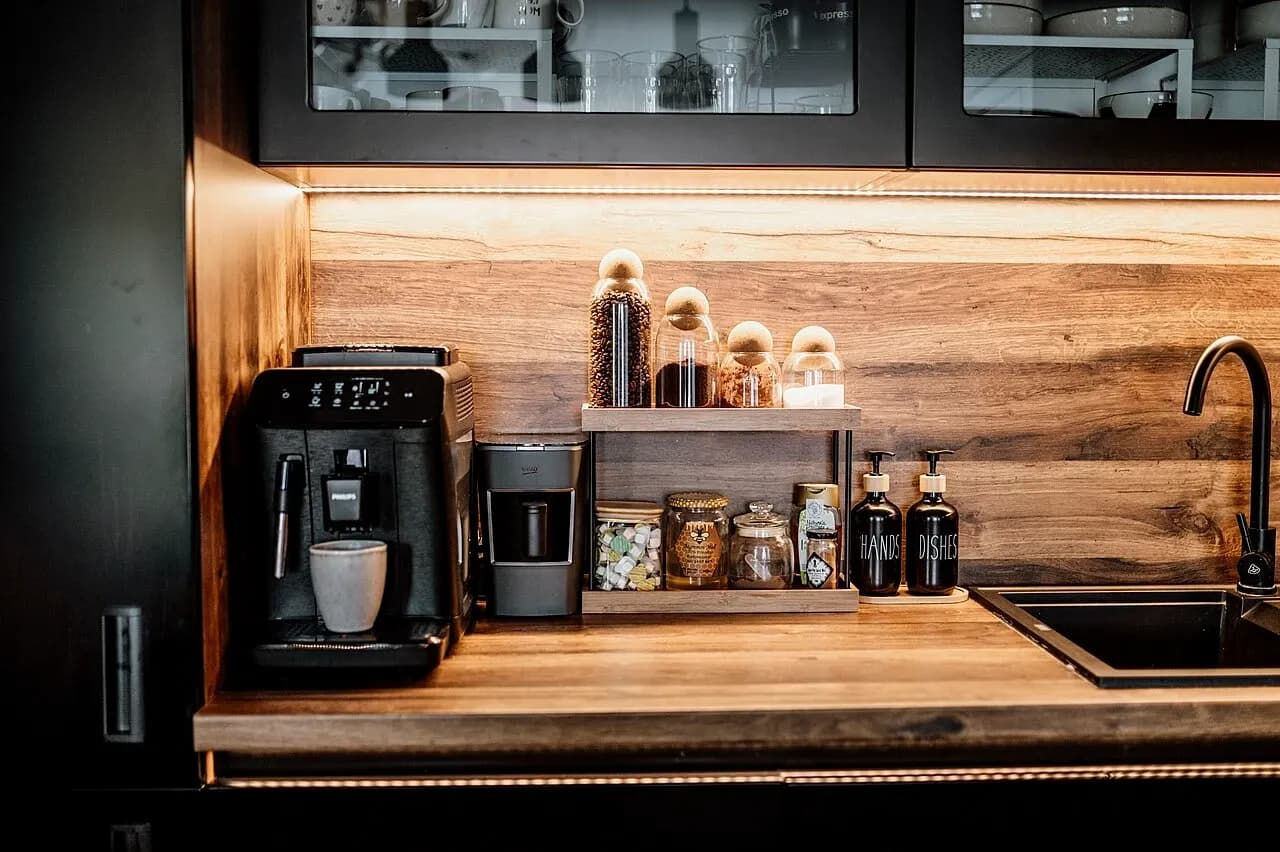 Coffee equipment and jars arranged on a kitchen counter