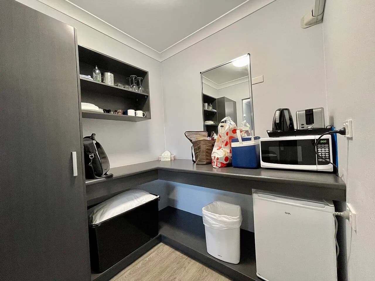 Compact kitchenette with appliances at accommodation in Grafton, Australia