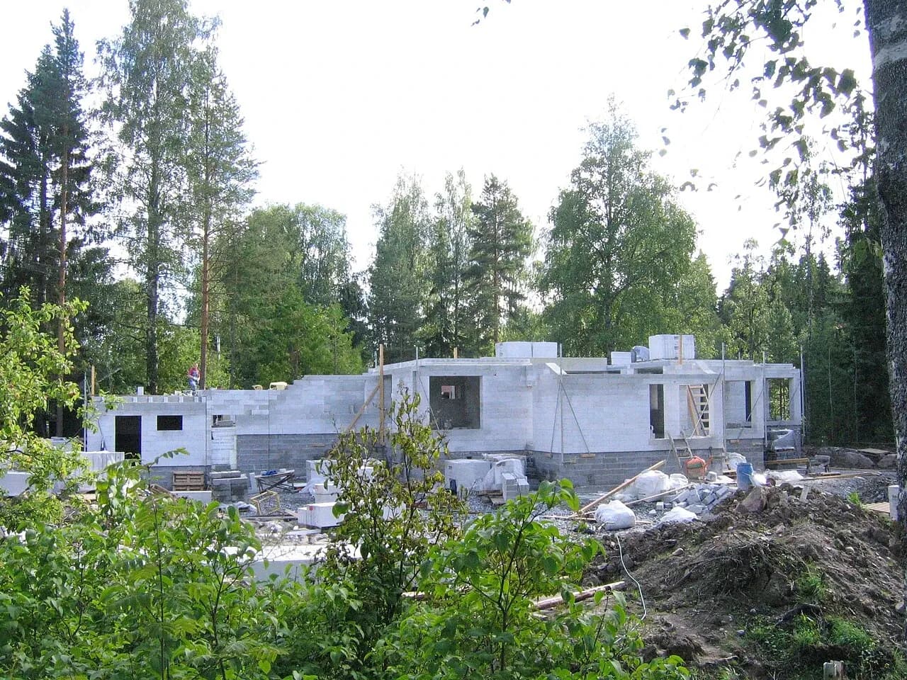 House under construction in a wooded setting in Kuopio, Finland