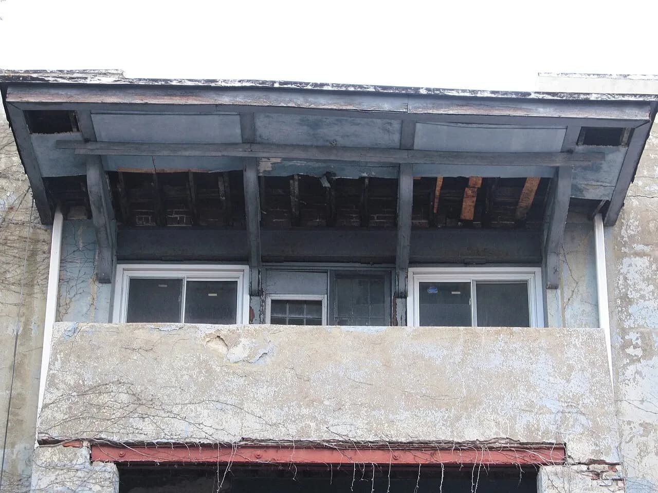 Weathered balcony surface and supporting structure on a Pittsburgh apartment building