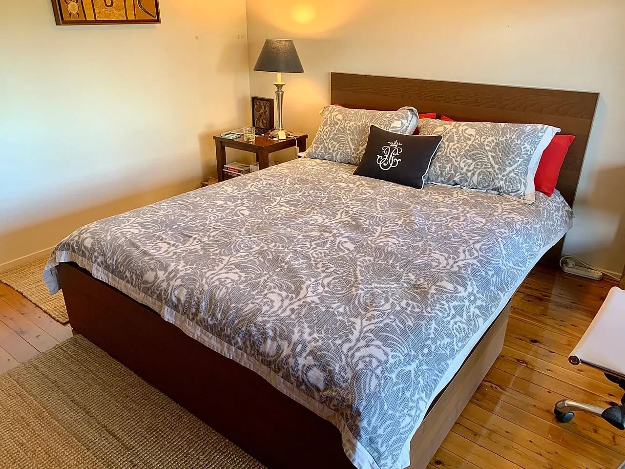Made bed with pillows in a bedroom in Brisbane, Australia
