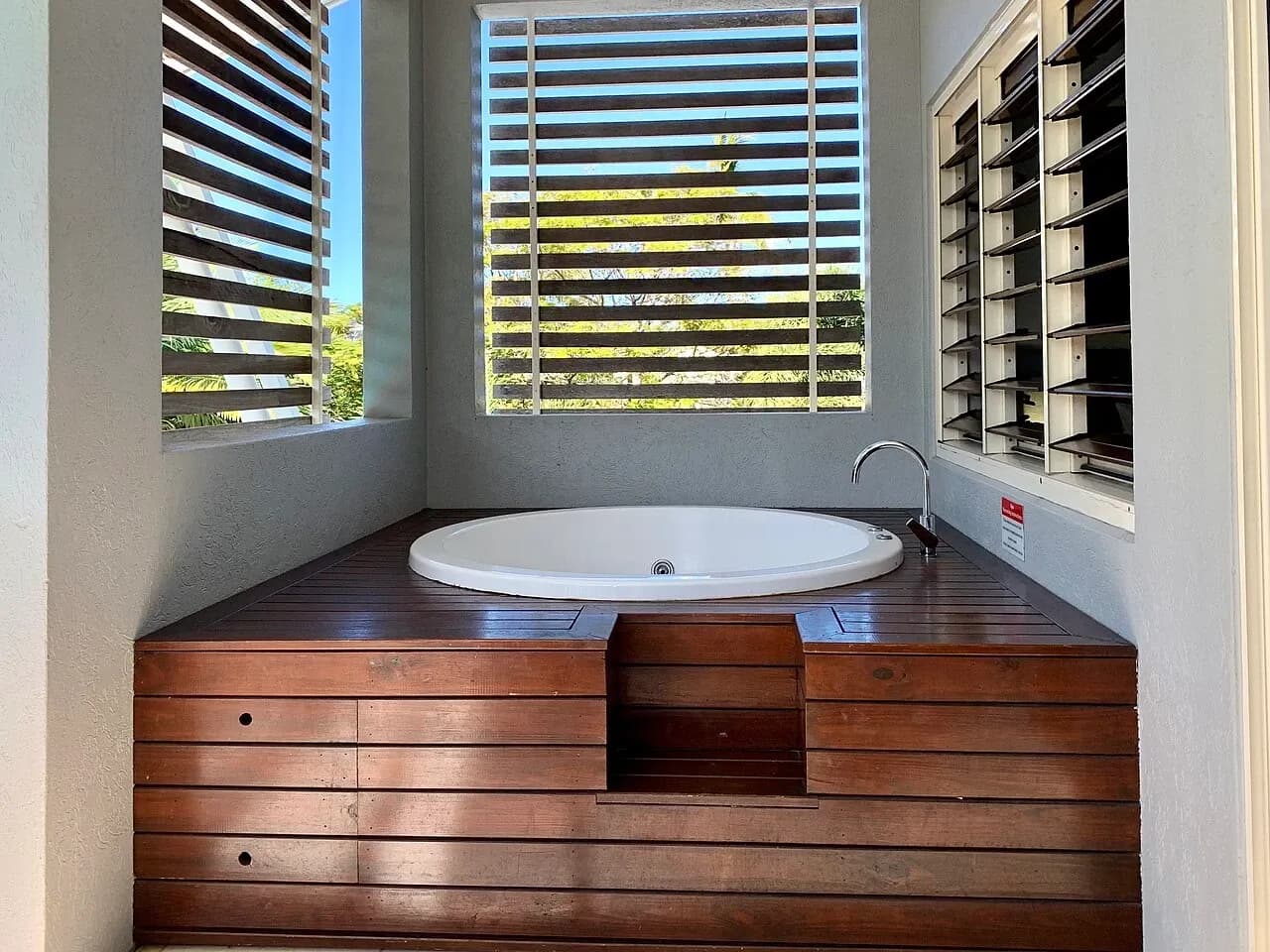 Bathtub on a screened balcony at accommodation in Port Douglas, Australia