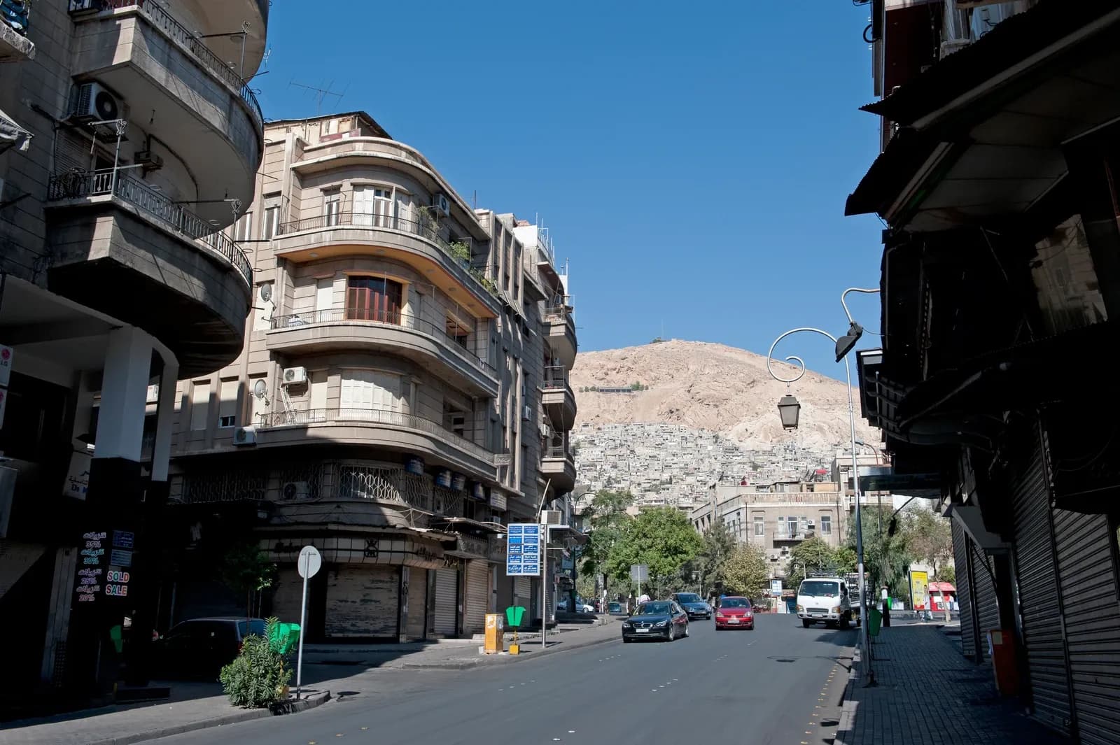 Balconied buildings and a hillside beyond Jamel Abdel Naser street in Damascus, October 2010