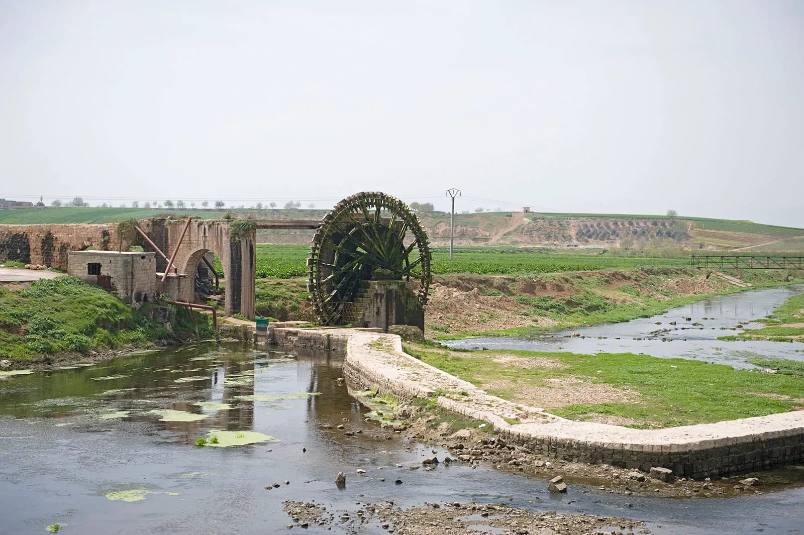 A waterwheel and stone structures beside the Orontes near Shaizar, April 2009 archive photograph