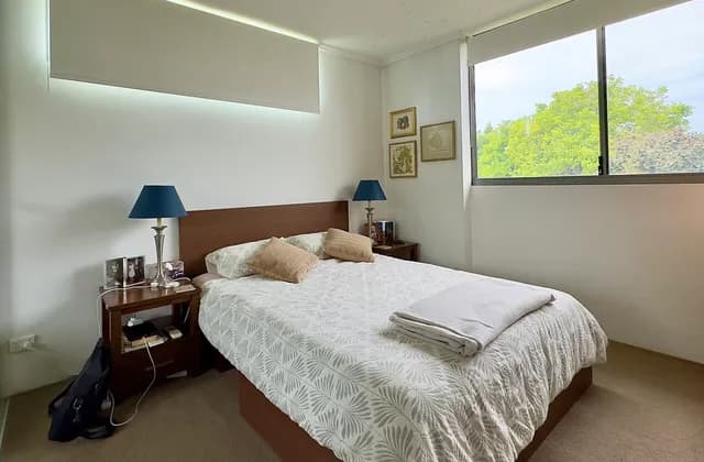 Furnished bedroom with two visible windows in Brisbane, June 2025