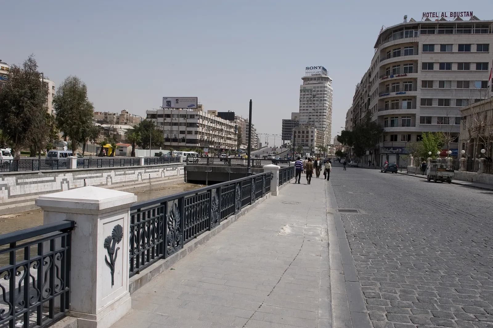 Broad view of Shoukry al-Quowatly Street in Damascus, with adjoining blocks and vehicles, April 2009