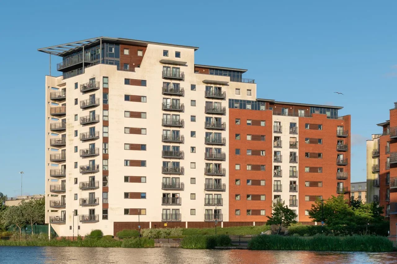 Apartment building with balconies beside the water at Galleon Way in Cardiff, Wales