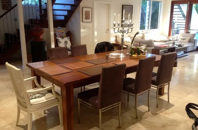 Dining table, lounge seating and stairs in a Brisbane home, Australia, photographed in April 2014