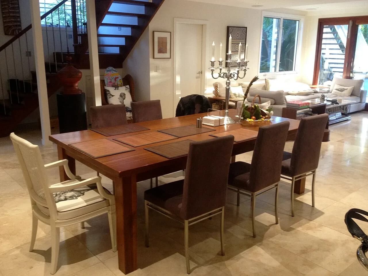 Dining table, lounge seating and stairs in a Brisbane home, Australia, photographed in April 2014
