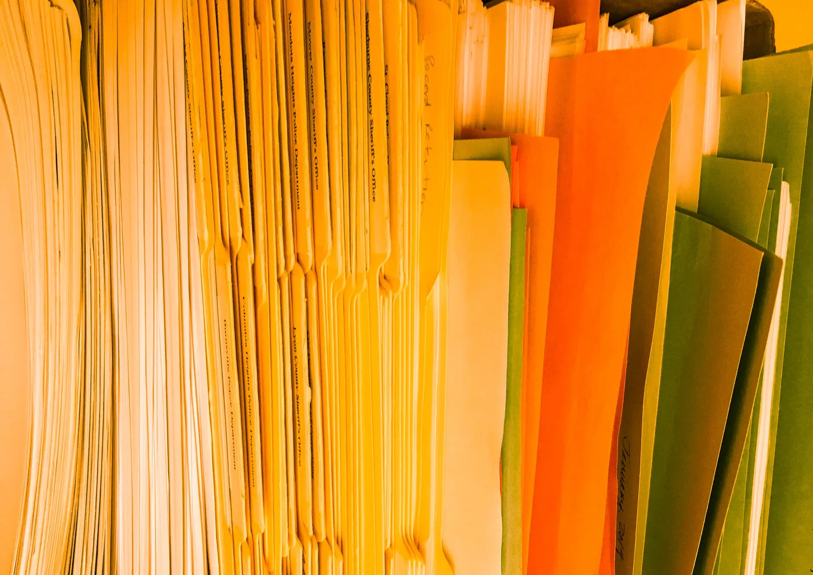 Row of yellow and green document folders, archive October 2015