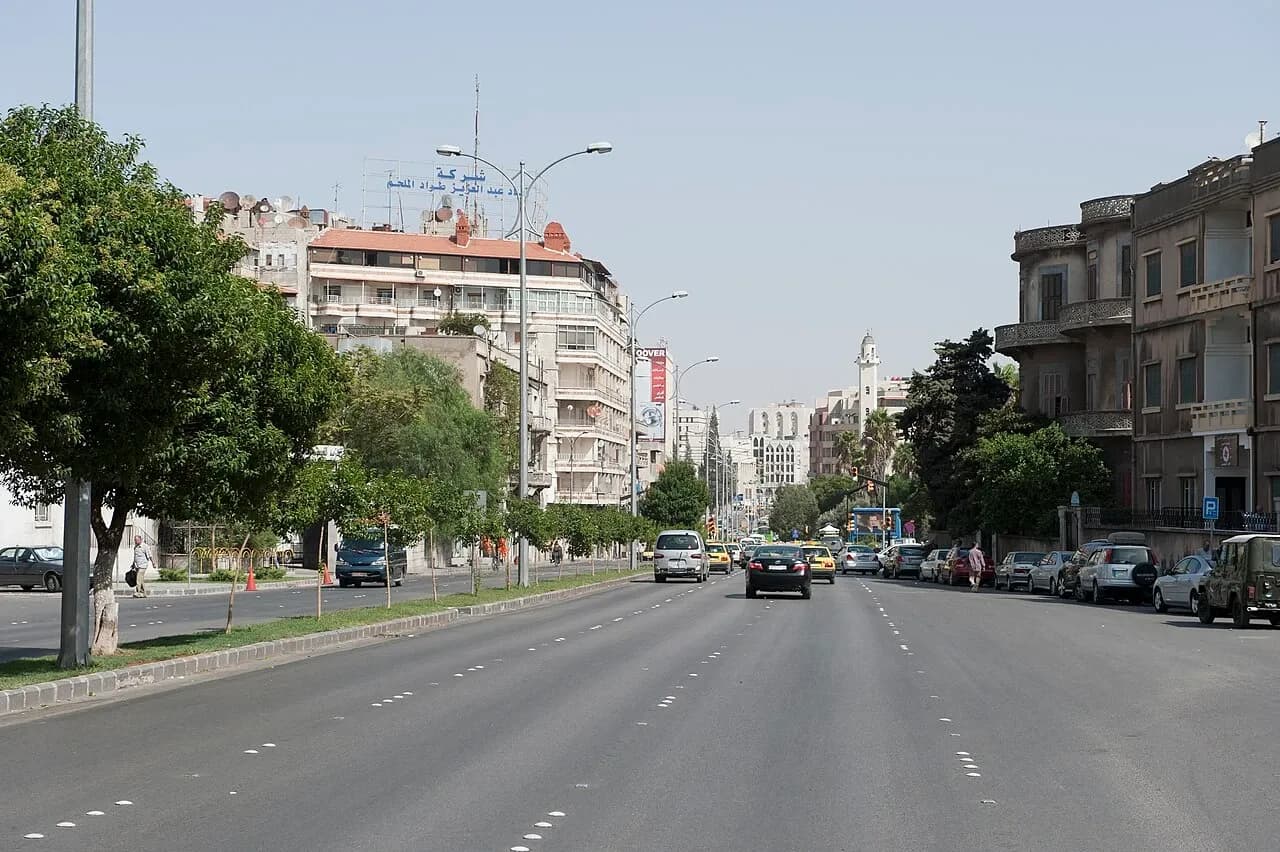 Street, buildings and parked cars in Homs, October 2010 archive