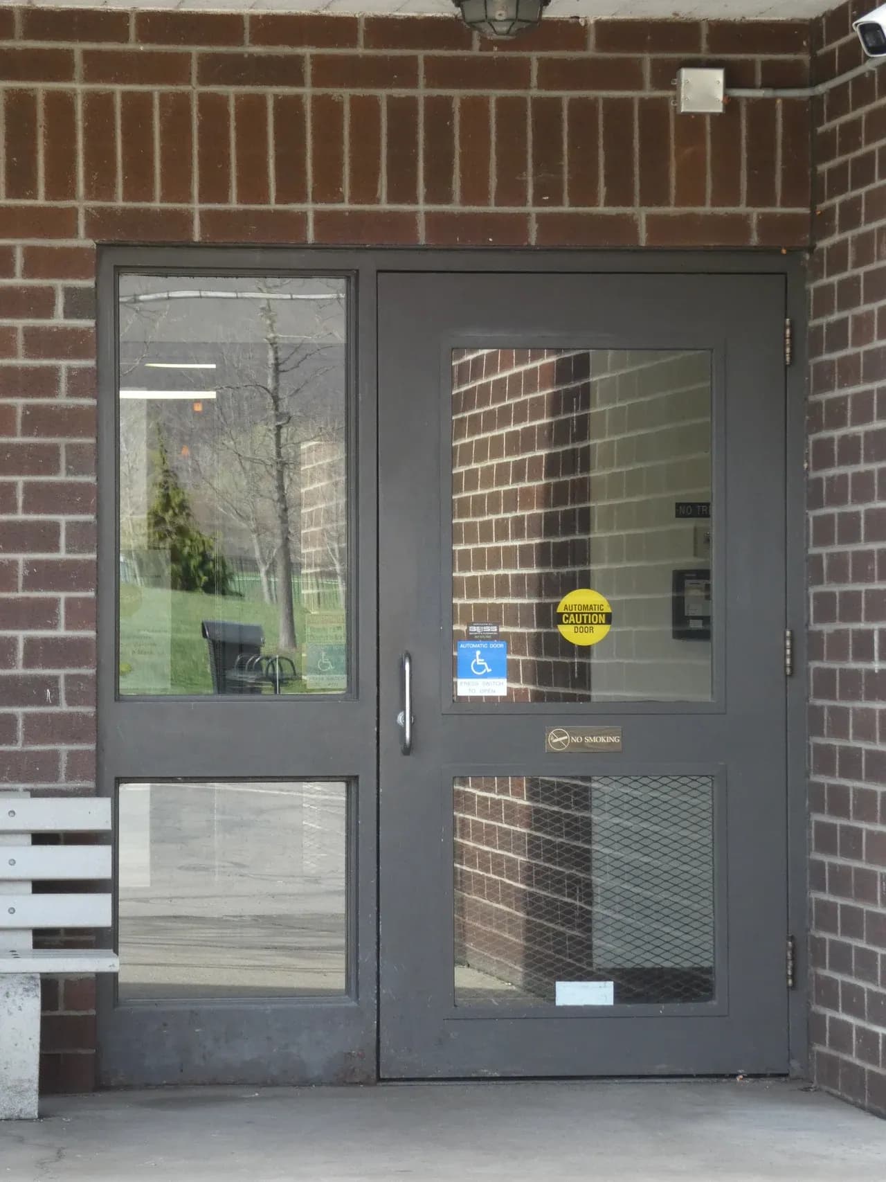 Glazed entrance door and brick surround at an apartment building