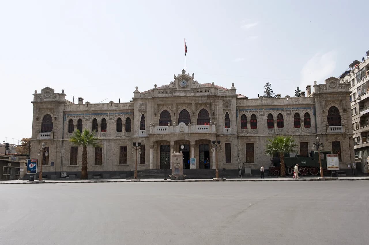 Stone facade and arched windows of Hejaz railway station in Damascus, photographed in 2009